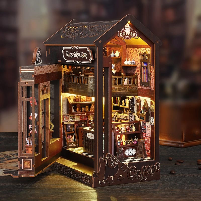 Assembled DIY Book Nook Kit glowing inside bookshelf